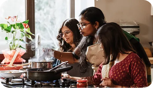 family cooking meal in kitchen